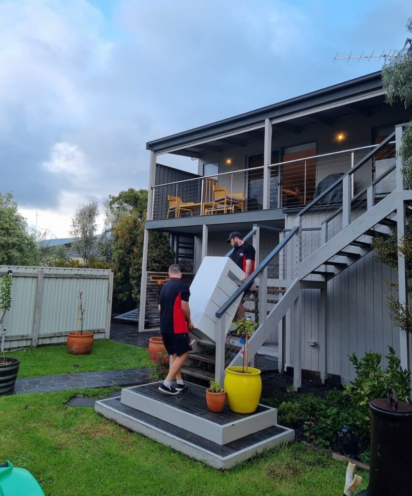 Removalists Carrying Cabinet Up Stairs - Steve's Removals Geelong